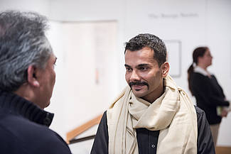 Artist Waseem Ahmed speaking to visitors, photo: Sebastian Bolesch