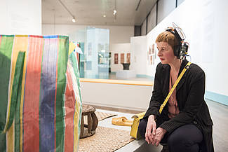 Marie-Luise Goerke wearing a preliminary model of headphones that work through gesture recognition, photo: Sebastian Bolesch